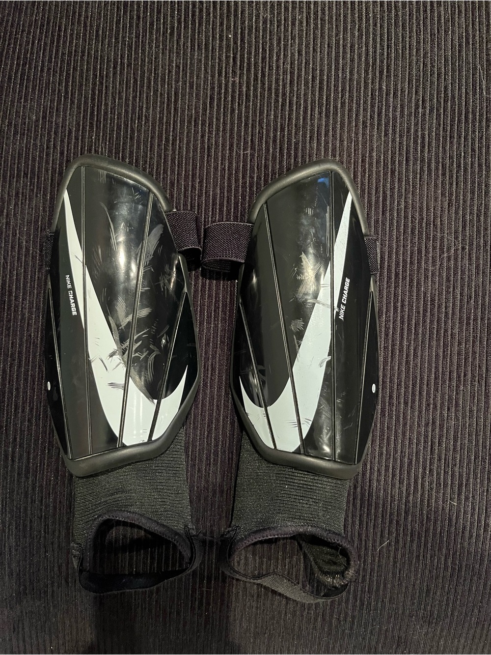 Nike Black Shin Guards with White Swoosh